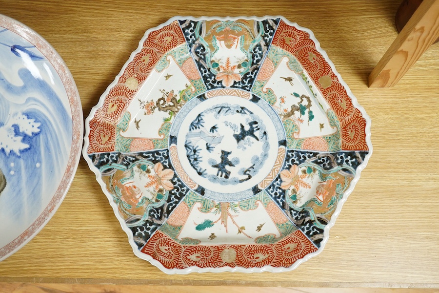 Two Japanese Imari style dishes, both Meiji period, one by Fukagawa decorated with a leaping carp, mountain mark to the base, largest 46cm in diameter. Condition - good